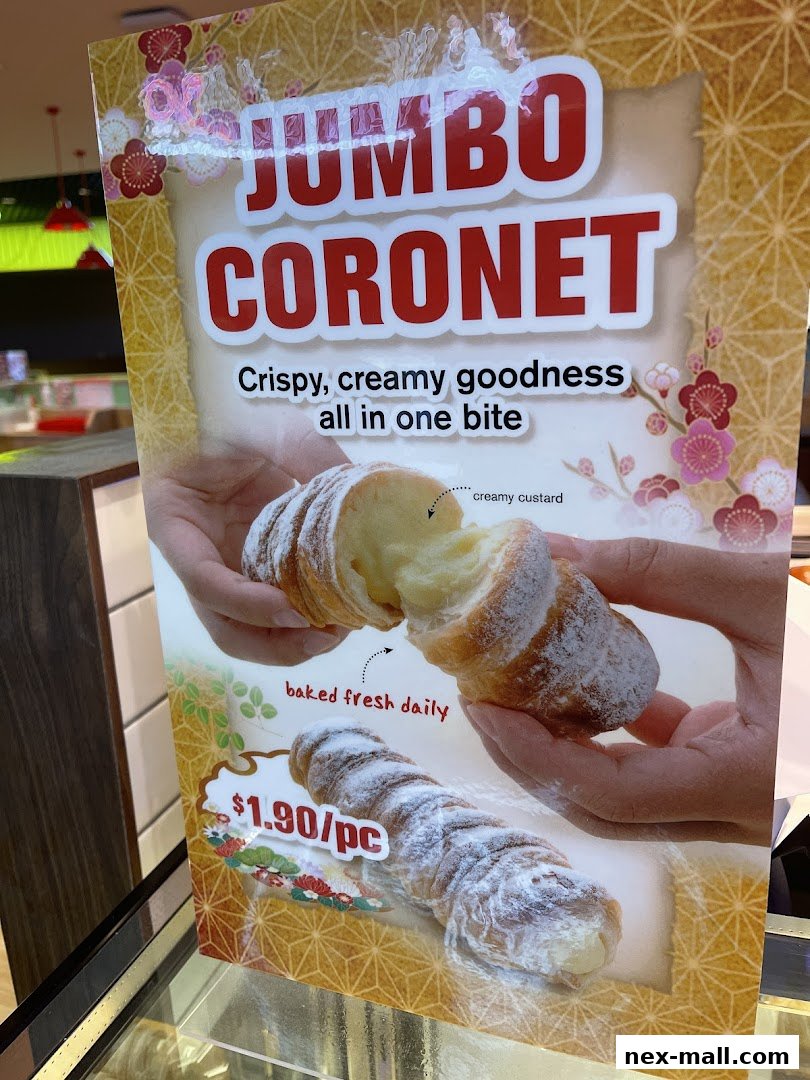 A sign advertising Jumbo Coronets, a crispy pastry filled with creamy custard.