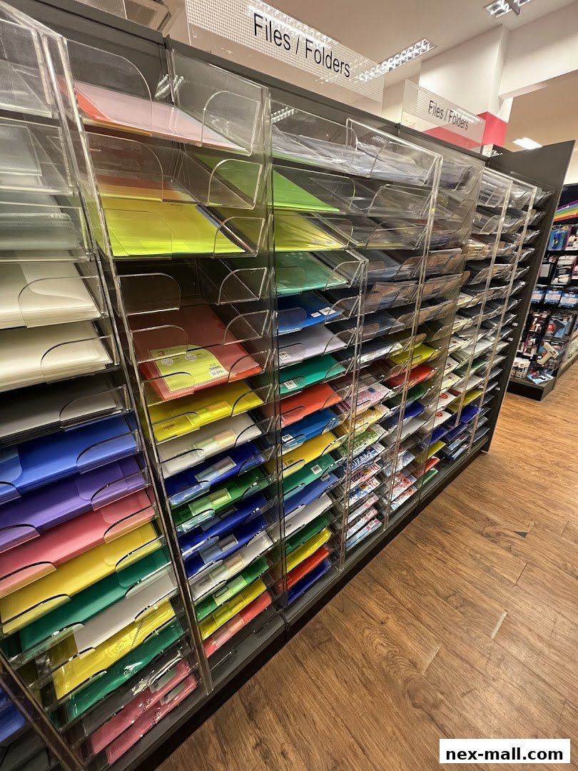 A display of colorful files and folders organized in clear plastic compartments.