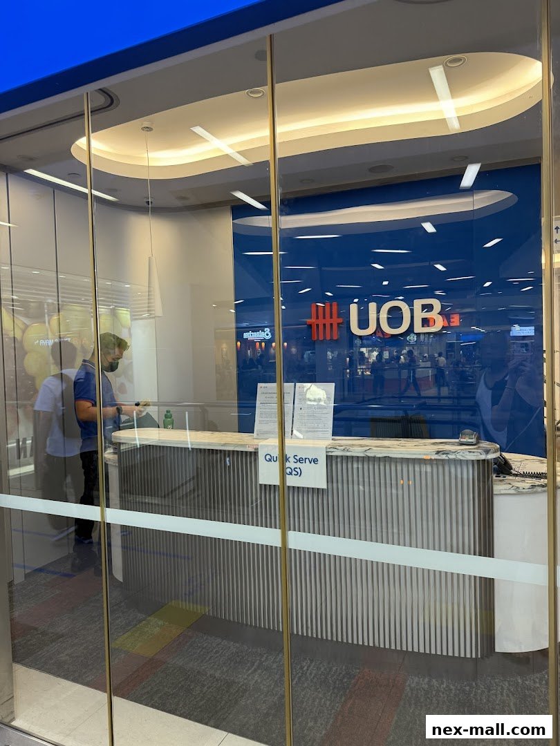 The UOB Bank branch entrance with a quick serve counter and staff inside.