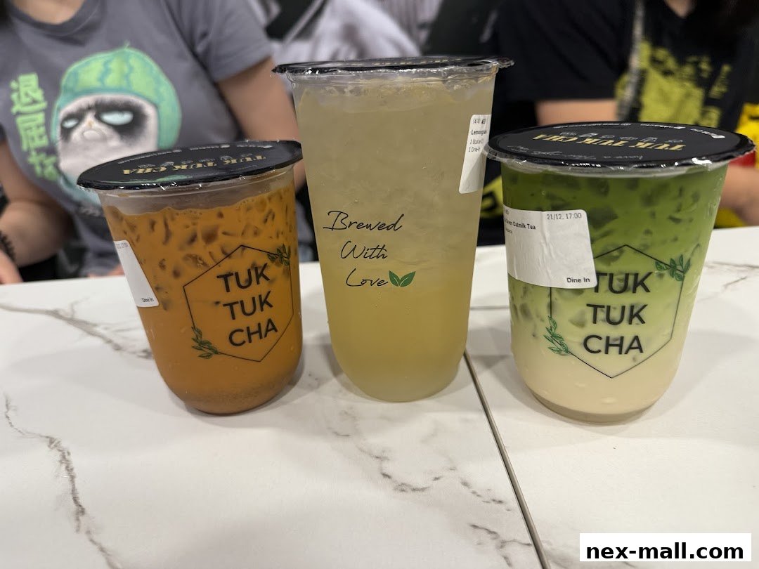 Three refreshing drinks from Tuk Tuk Cha, including Thai milk tea, lemongrass, and matcha.