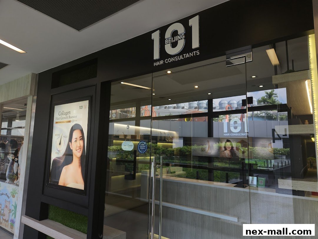 The exterior of Beijing 101 Hair Consultants, featuring a large glass storefront and promotional posters.