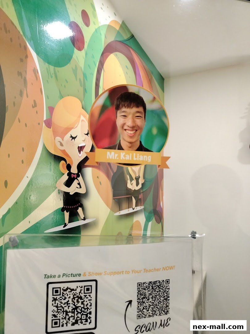 A photo of a teacher's cutout and QR codes for support at Aureus Academy.