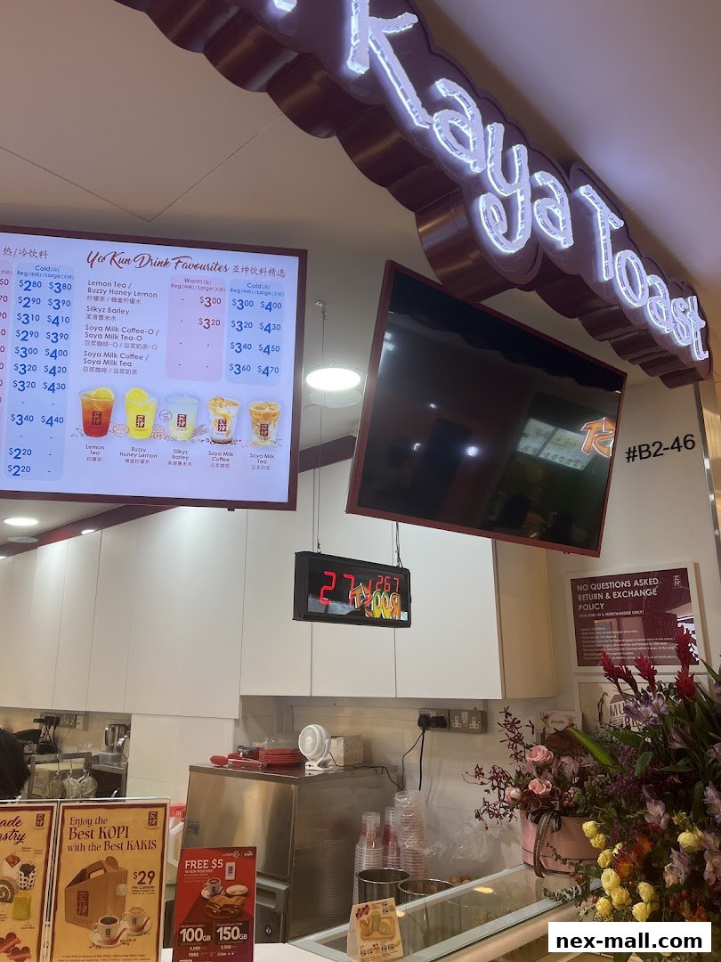 A digital menu board displaying Ya Kun Kaya Toast drink favorites with prices.