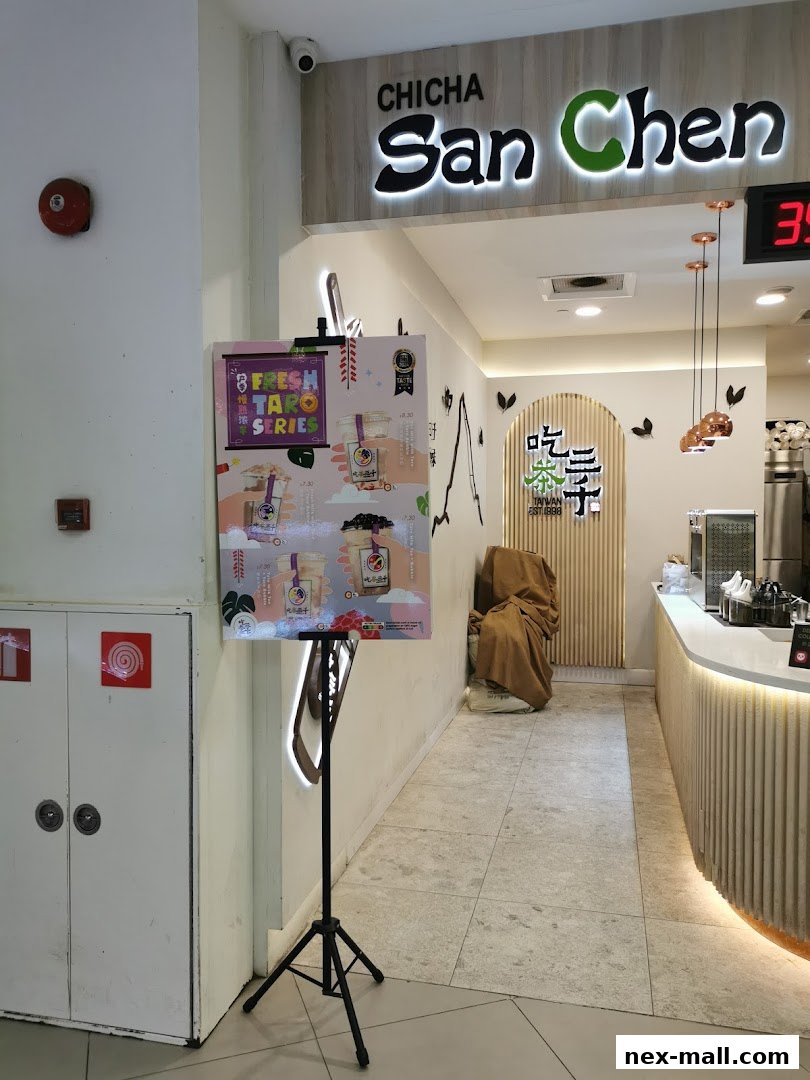 The entrance to CHICHA San Chen NEX, featuring a promotional poster and the shop's signage.
