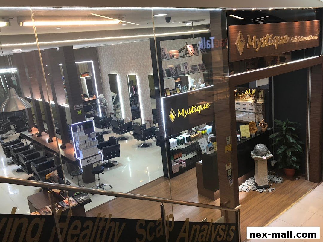 Interior view of a modern hair salon with multiple styling stations and product displays.