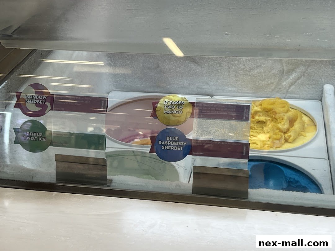 A display case filled with various flavors of ice cream and sorbet.