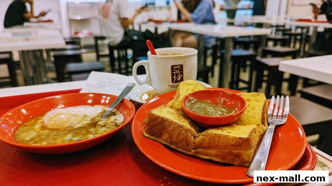 A close-up of a traditional Singaporean breakfast set with kaya toast, soft-boiled eggs, and coffee.