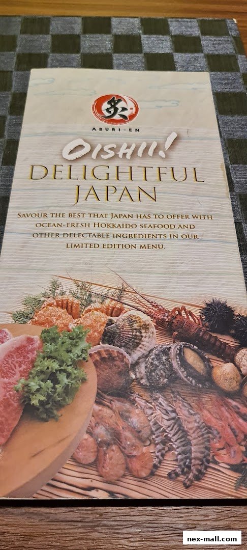 A menu from Aburi-EN featuring 'Oishii! Delightful Japan' with images of seafood and meat.