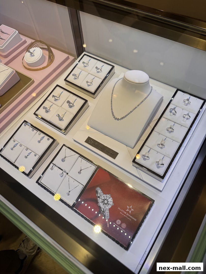 A display case filled with sparkling diamond jewelry, including necklaces and rings.