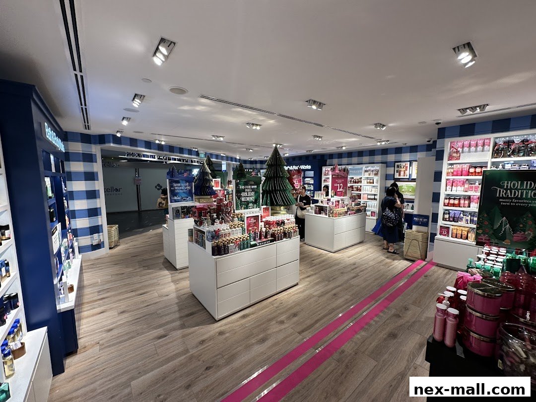 Interior view of Bath & Body Works store with holiday displays and products.