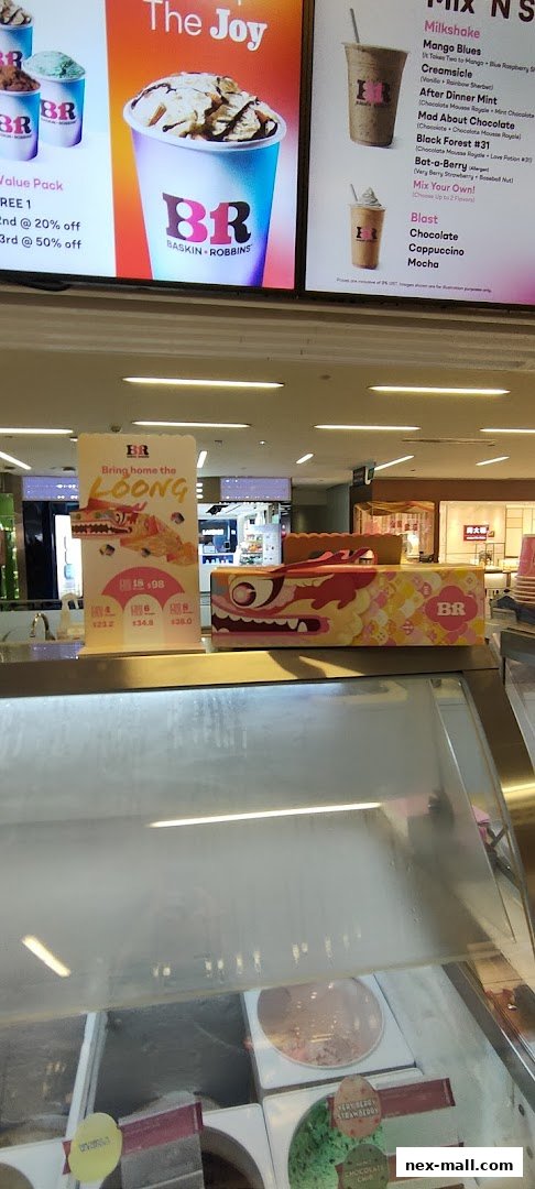 Baskin-Robbins shop interior with ice cream displays and promotional signage.