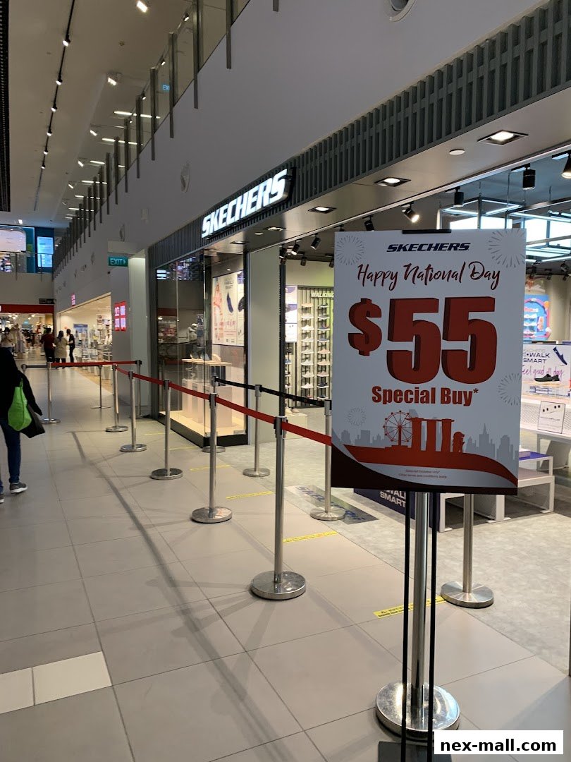 Skechers store front with a promotional sign for a National Day special buy.
