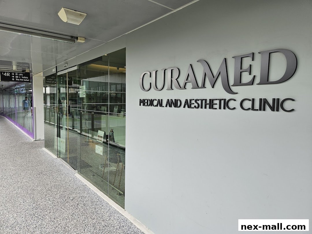 The entrance and signage of CuraMed Medical and Aesthetic Clinic.