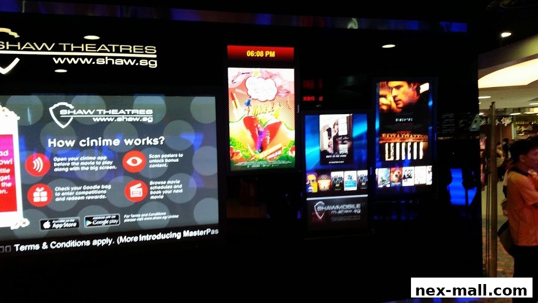 Digital displays showcasing movie posters and information for Shaw Theatres.