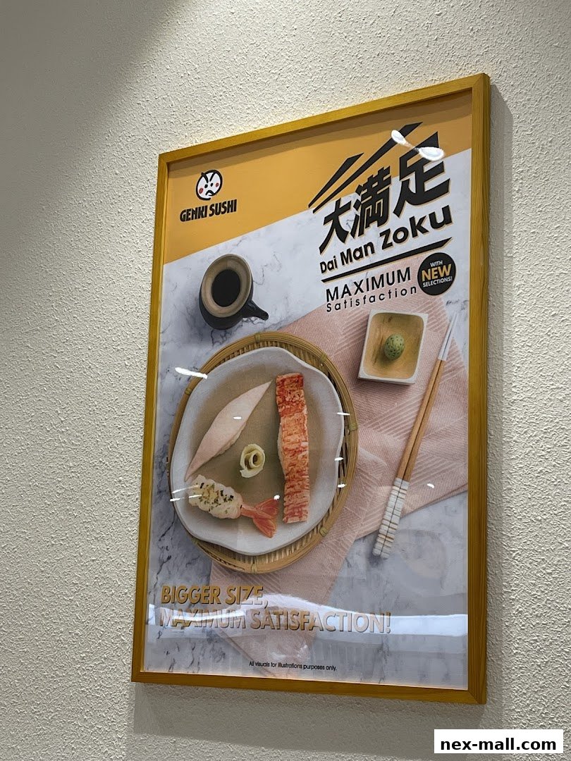 A framed advertisement for Genki Sushi featuring a dish with shrimp, fish, and crab sticks.