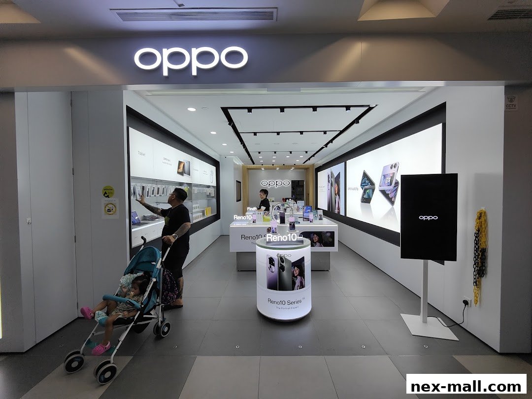 Interior of an OPPO concept store showcasing phones and tablets with customers browsing.