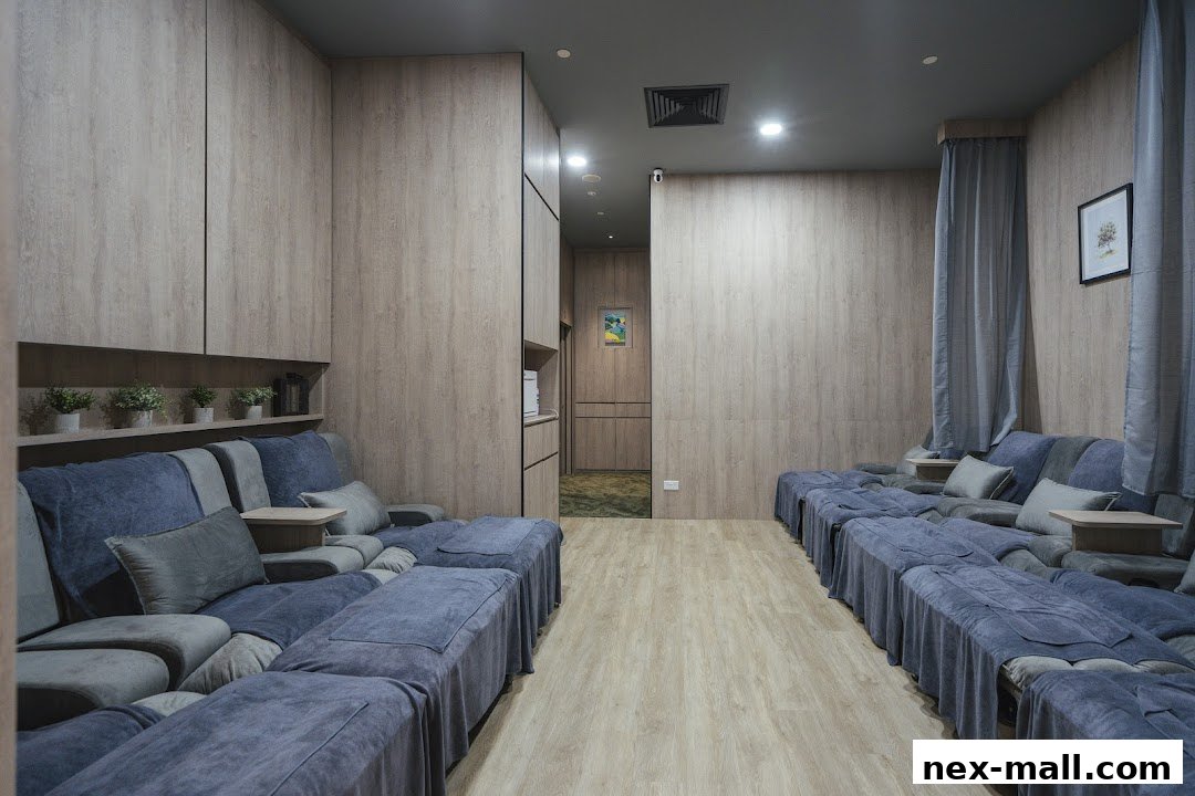 Interior view of a reflexology center with comfortable seating and calming decor.