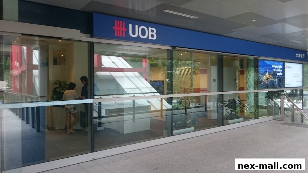 The exterior of a UOB bank branch with large glass windows and signage.