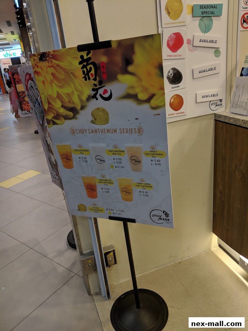 A menu board displays the Chrysanthemum Series drinks and other seasonal specials from PlayMade.