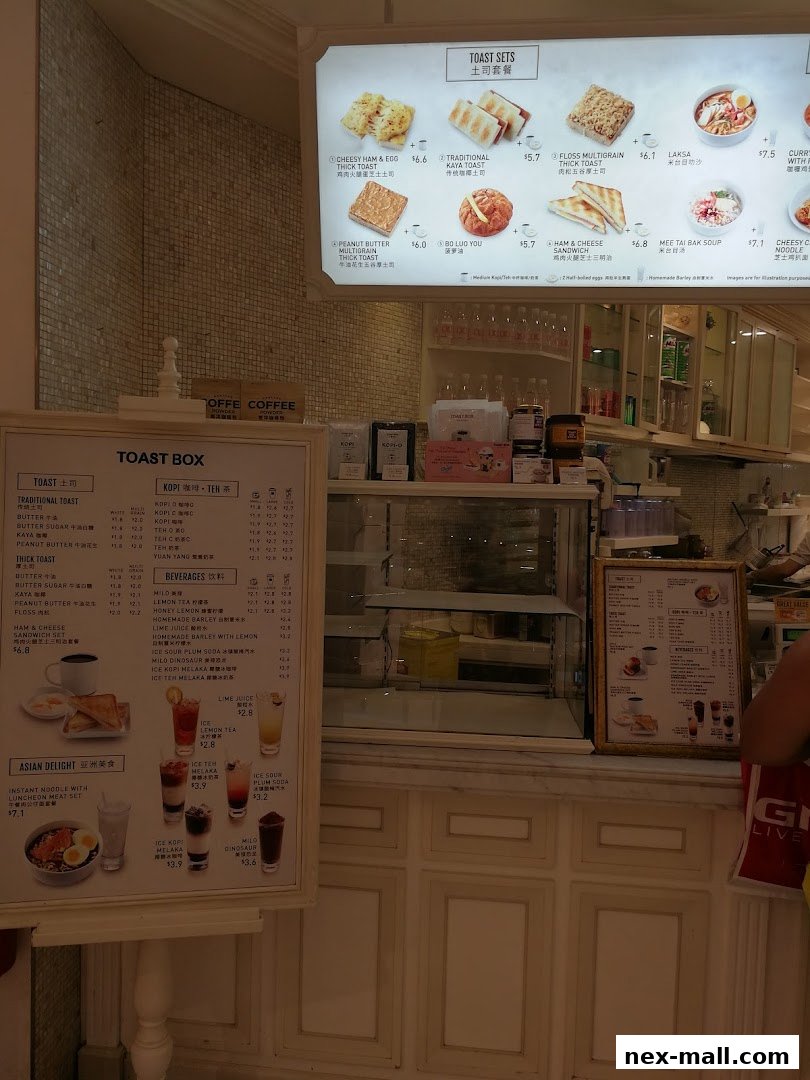 A menu board displaying various toast sets, beverages, and Asian delights from Toast Box.