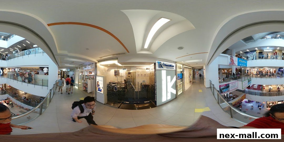 A view of the TK TrichoKare hair loss and scalp treatment shop entrance in a mall.