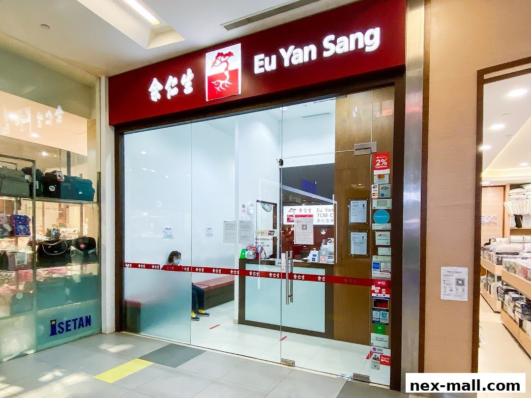 The entrance of Eu Yan Sang TCM Clinic at Serangoon NEX, featuring its branding and a waiting area.