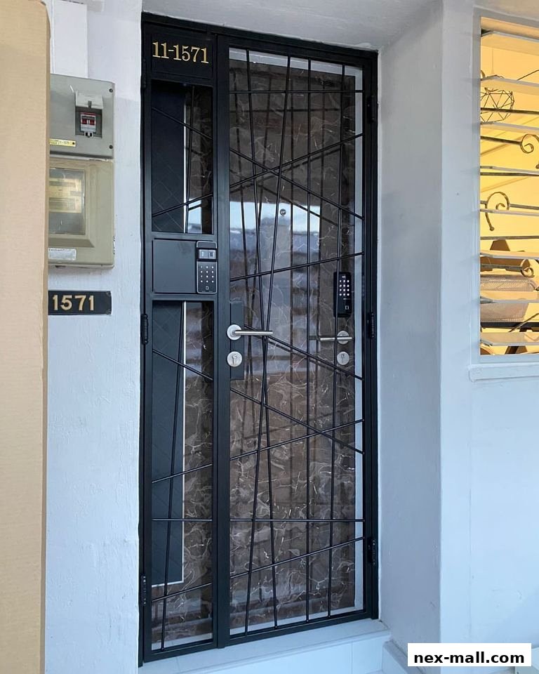A modern digital lock installed on a metal gate with a marble-patterned door.