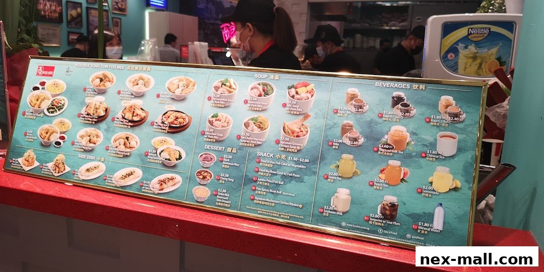 A menu board for Koo Kee Yong Tow Foo Mee, showcasing various dishes and beverages.