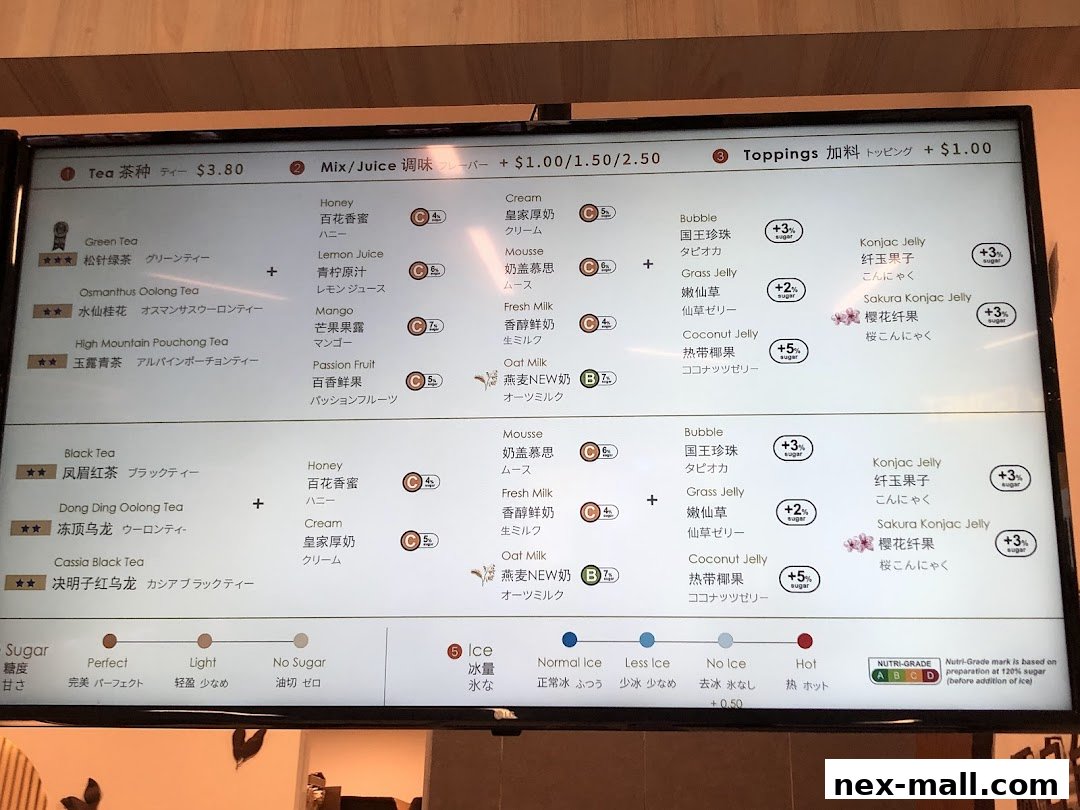 A digital menu board displaying various tea options, toppings, and sugar levels.