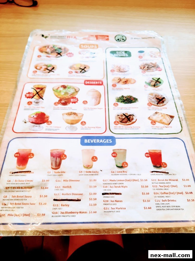 A menu from Ayam Penyet Ria featuring soups, side dishes, desserts, and beverages.