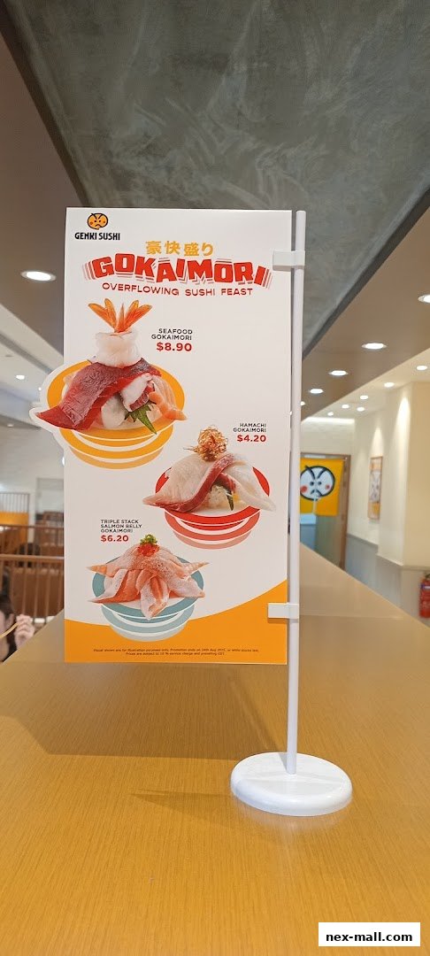 A promotional sign for Genki Sushi showcasing three different sushi platters.