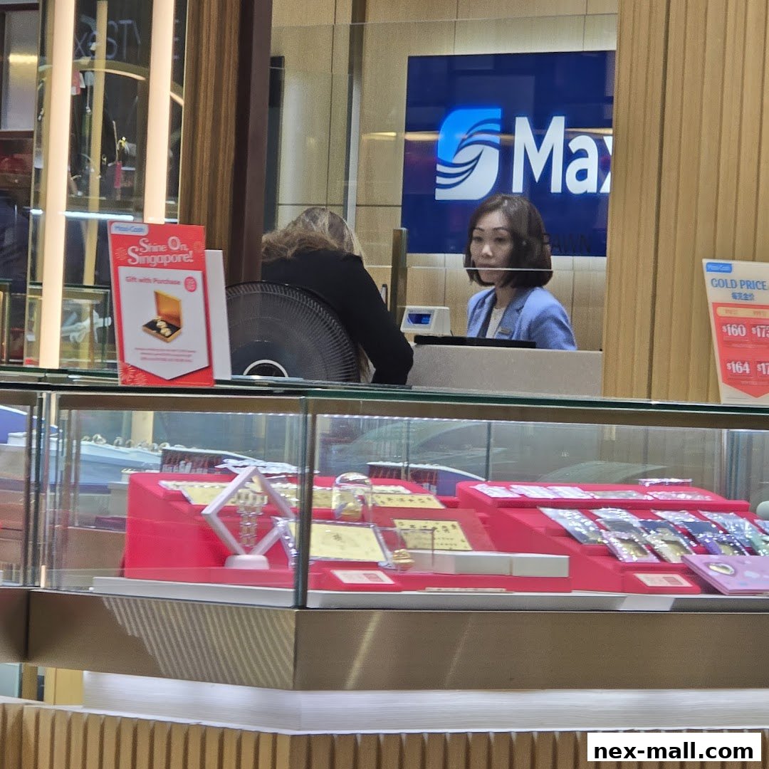 A jewelry store counter with display cases and staff behind the counter.