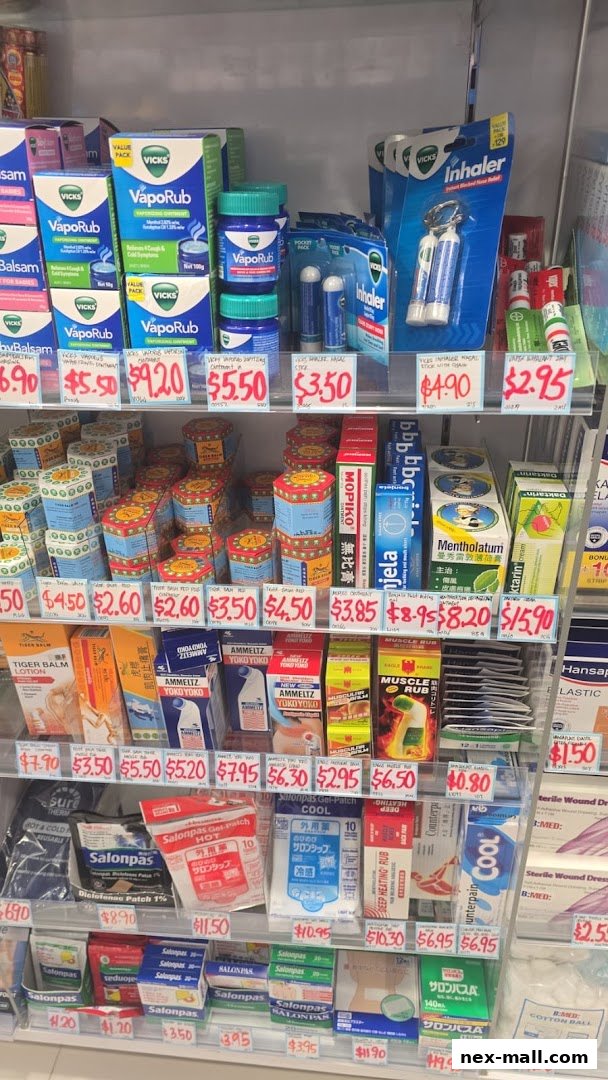 A retail display shelf stocked with various health and wellness products, including balms, inhalers, and pain relief patches.