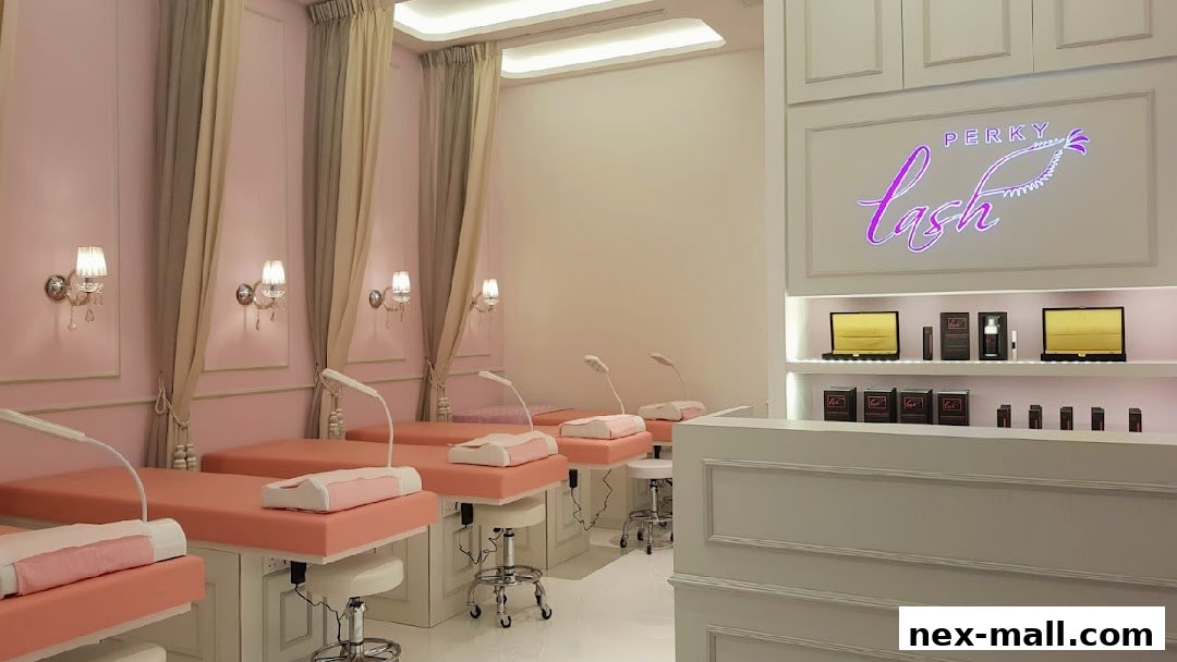 Interior of a clean and elegant eyelash extension salon with multiple treatment beds.