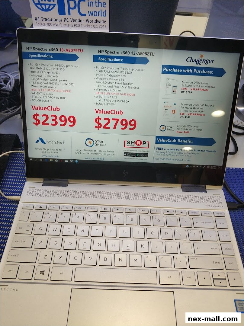 A laptop displaying product information for HP Spectre x360 laptops at Challenger.