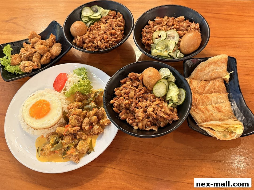 A spread of Taiwanese comfort food including rice dishes, fried chicken, and scallion pancakes.