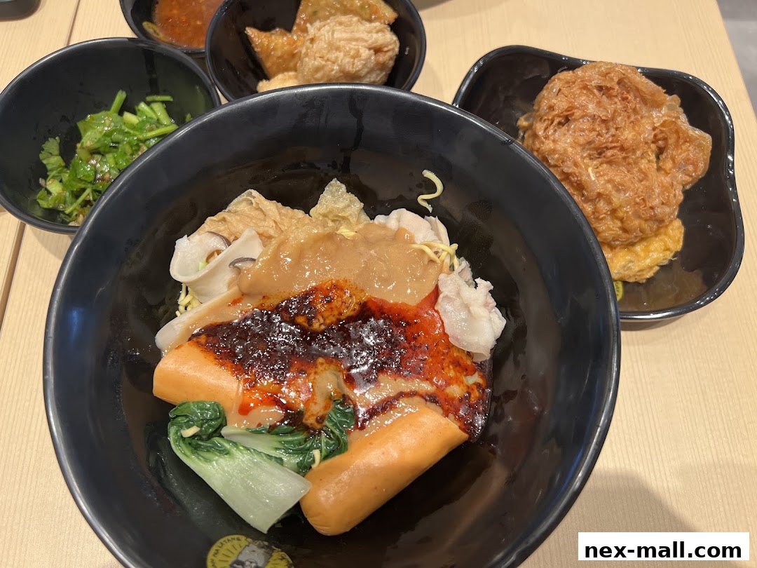 A close-up of a delicious mala tang dish with various ingredients and side dishes.