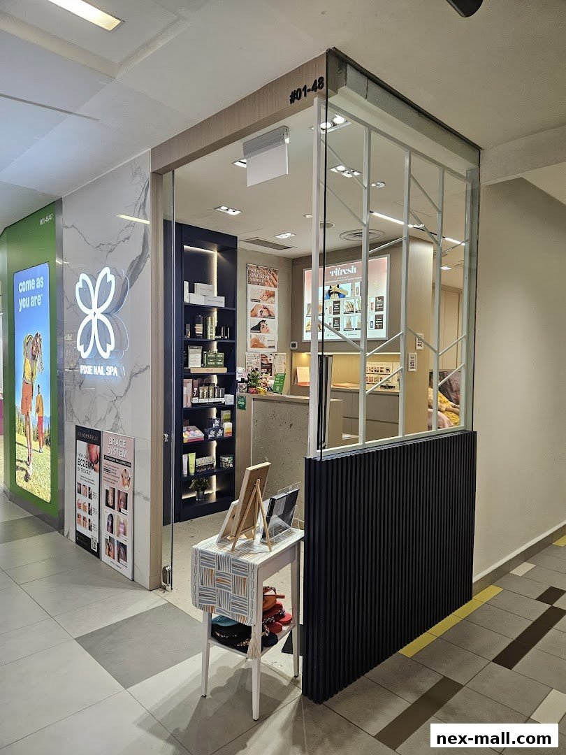 The entrance to Pixie Nail Spa, showcasing its clean and modern interior with products on display.