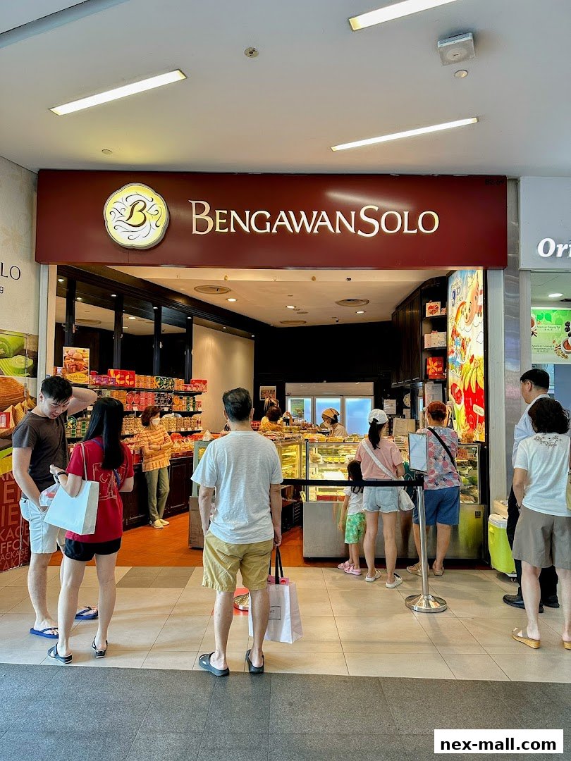 Customers queue outside Bengawan Solo, a shop selling baked goods and traditional snacks.