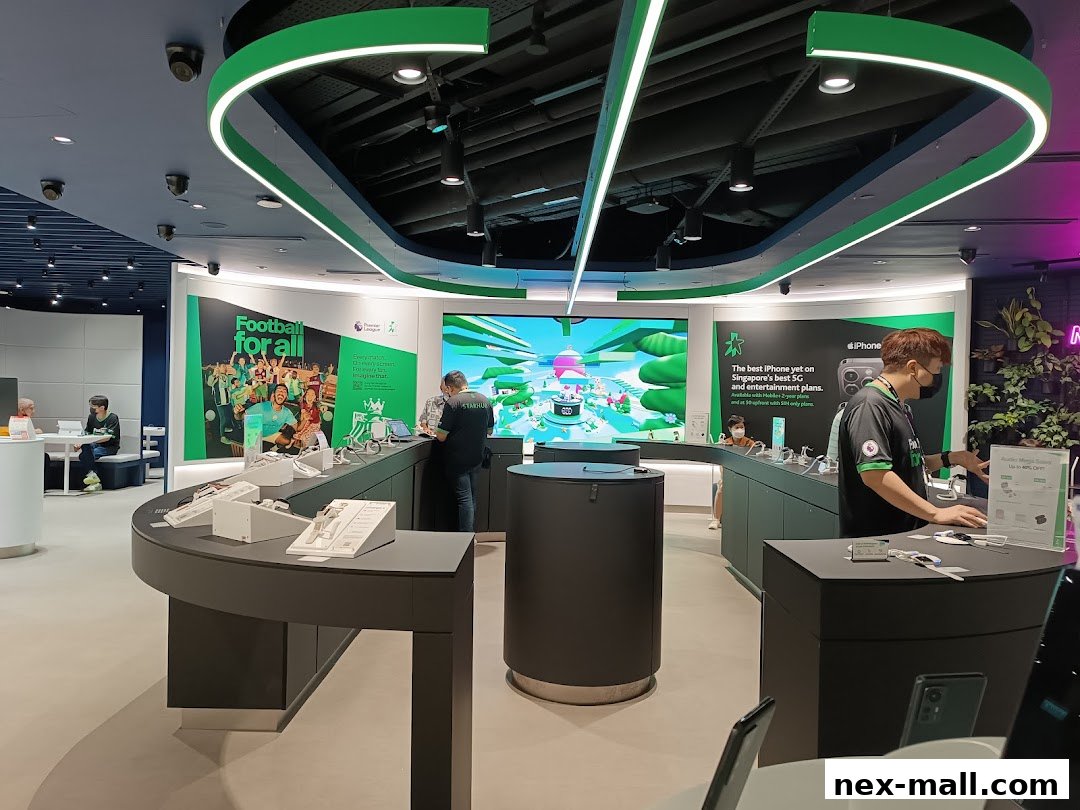 Interior of a modern telecommunications store with display units and staff assisting customers.