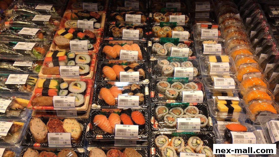 A display of various pre-packaged sushi sets and rolls in clear plastic containers.