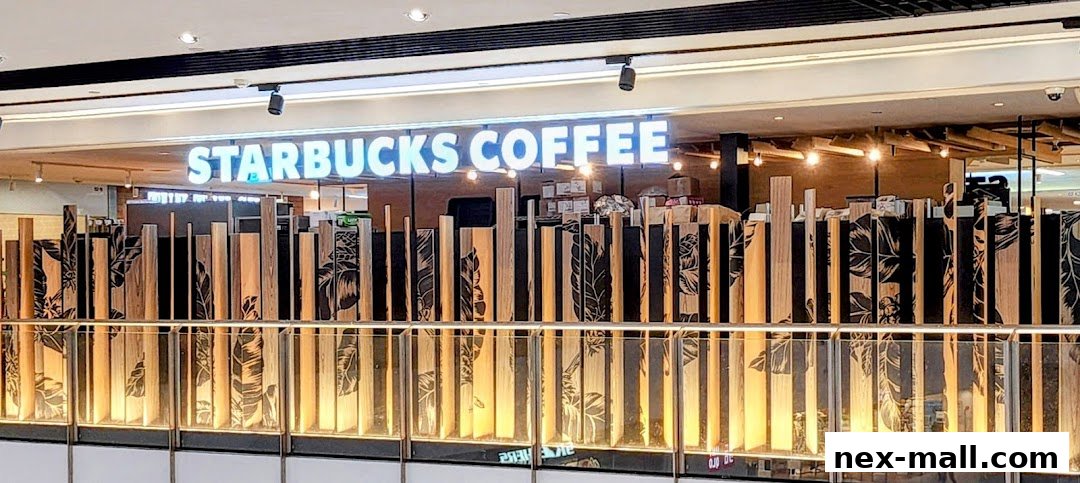 The exterior of a Starbucks coffee shop with illuminated signage and a decorative wooden screen.