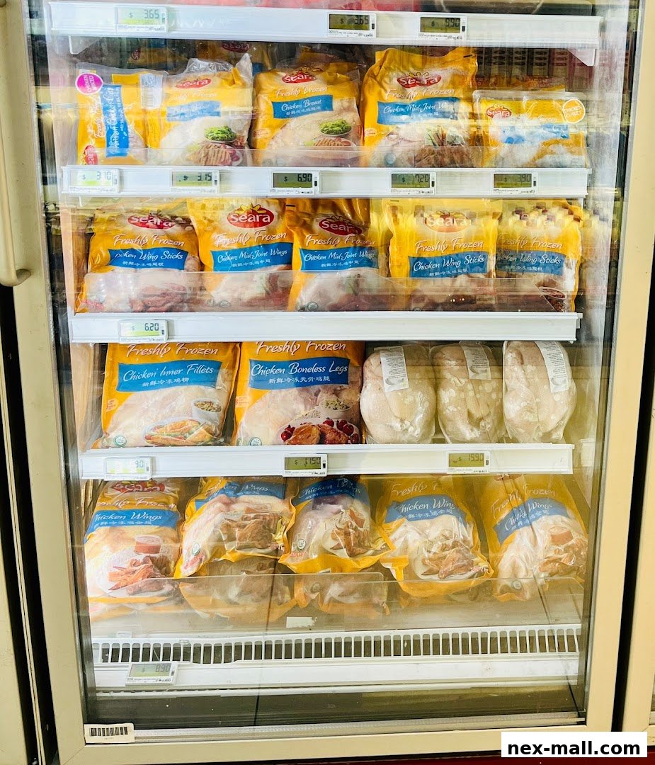 A refrigerated display case filled with various frozen chicken products from Seara.