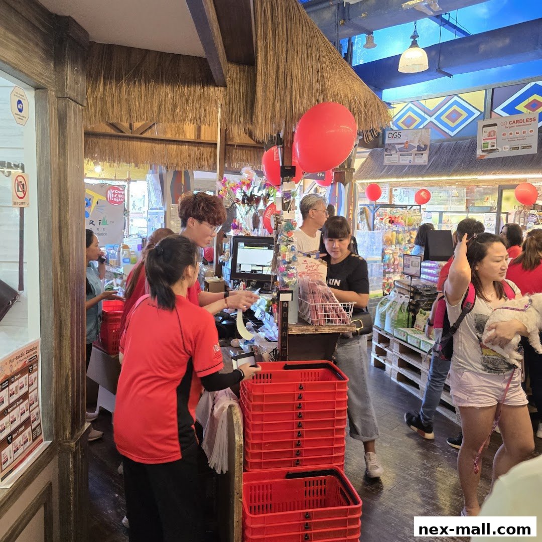 Customers and staff at the checkout counter of a pet store with red balloons.