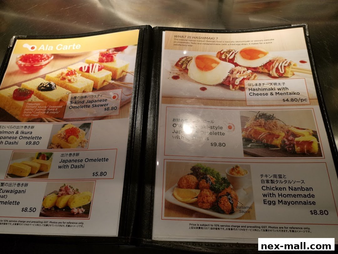 A menu from Tamago-EN NEX showcasing various Japanese omelette dishes and hashimaki.
