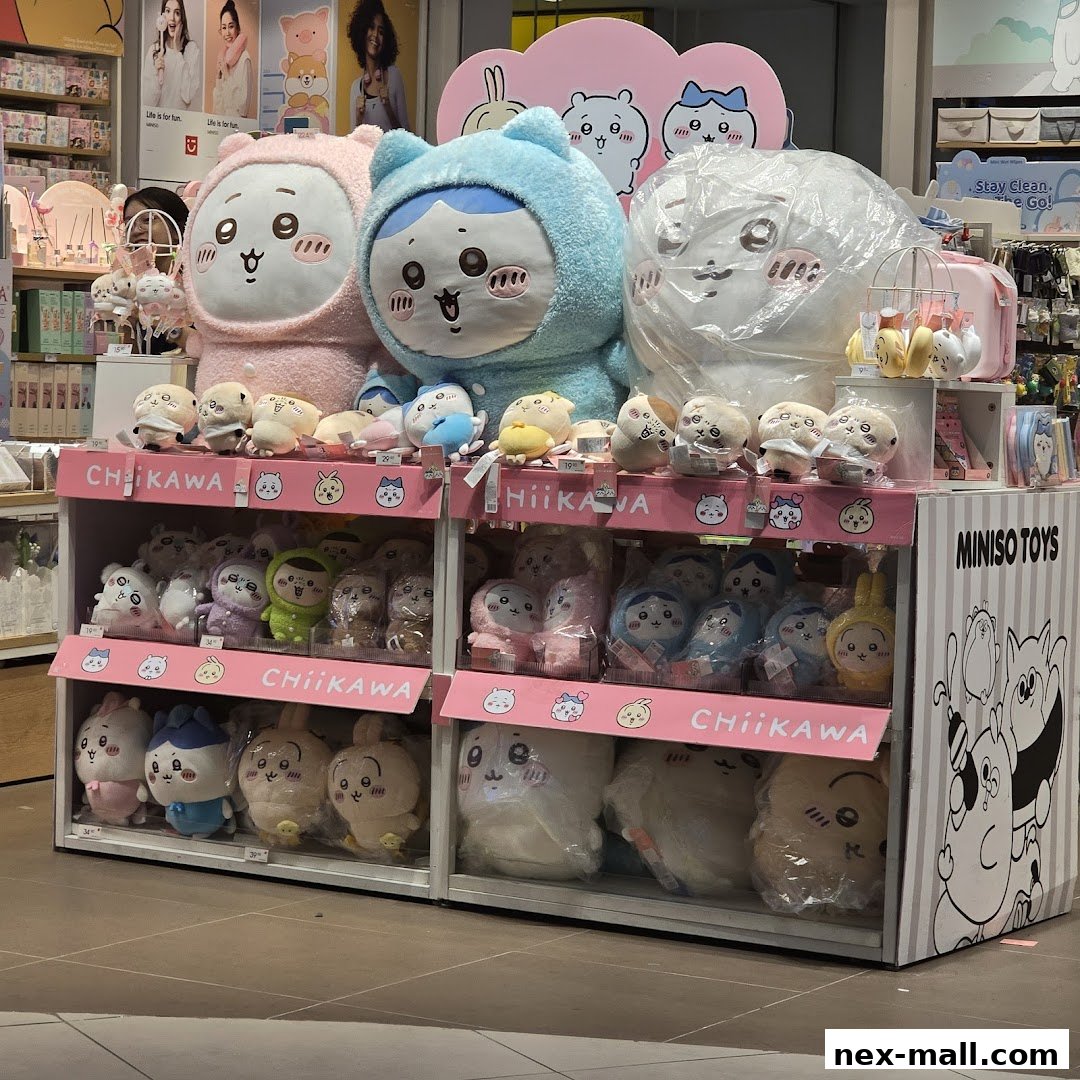 A display of cute plush toys, featuring large character figures and smaller collectible items.