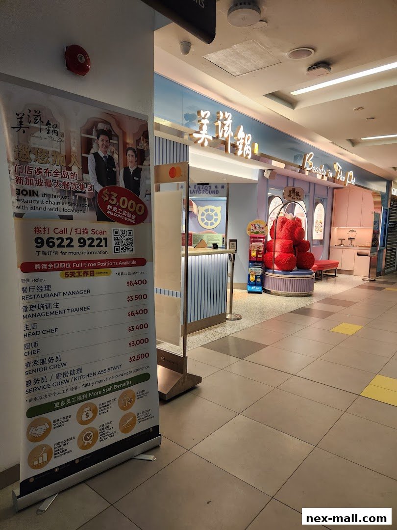 The entrance of Beauty in The Pot restaurant with a recruitment banner outside.
