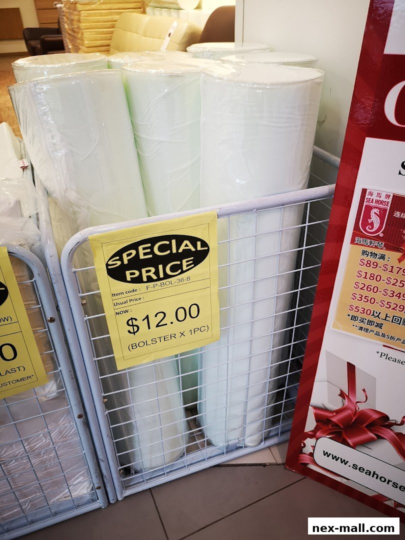 Rolled up foam products are displayed in a store with a special price tag.