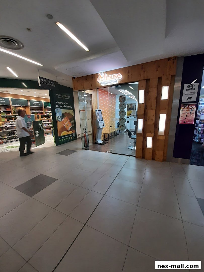 The exterior of EC House All Range Cuts hair salon with a modern wooden facade and bright interior.