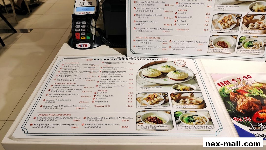 A menu for Shanghai Fried Xiao Long Bao with various dumplings and noodles.